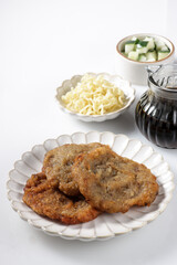 Pempek Kulit is a fish cake, made from fish skin, served with cuko sauce.