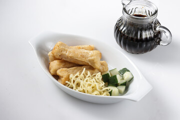 Pempek Lenjer is one of various fish cake from Palembang, South Sumatera served with cuko.