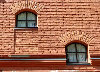 Windows on an old brick house.