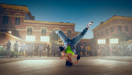 Street dancer girl  dance breakdance on evening street