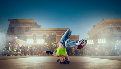 Street dancer girl  dance breakdance on evening street