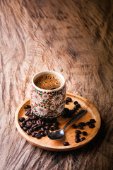 Cup of espresso coffee on  wood background