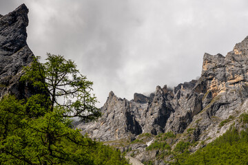 Rocky mountains of Beautiful Yading Nature Reserve in Autumn, Yading, Sichuan, China, Dramatic sky, copy space for text