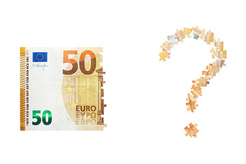 Puzzle made from fifty euro note and isolated on a white background.  Inflation and hyper inflation...