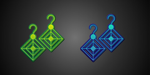 Green and blue Earrings icon isolated on black background. Jewelry accessories. Vector