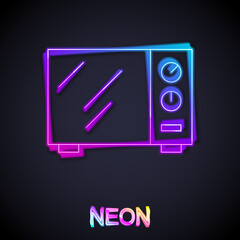 Glowing neon line Microwave oven icon isolated on black background. Home appliances icon. Vector