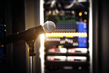 Close up microphone and blur sound mixer background for studio editor record and broadcasting producer live the media concepts.