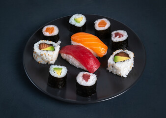 Maki sushi plate on dark background