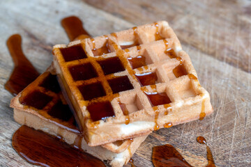 square sweet soft waffles in bee honey