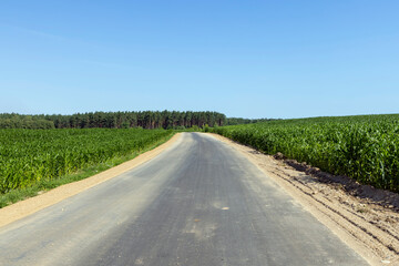 Fototapeta na wymiar Construction and repair of a new highway in rural areas