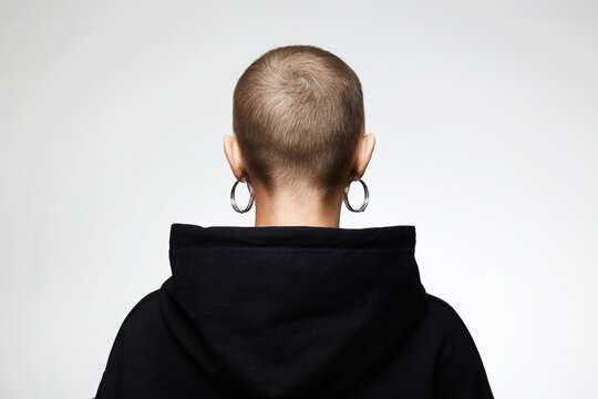 Back Of The Head. Girl With Short Haircut. Bald Woman With Earrings