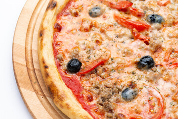 Delicious Italian pizza with minced meat, cheese, tomatoes, olives and peppers.