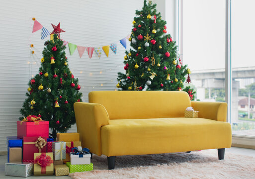 Interior Living Room Home Design Full Decoration For Christmas Eve Festival Full Of Decorated Pine Tree With Balls Bells Star And Stack Of Colorful Paper Wrapped Present Gift Boxes Near Cozy Sofa