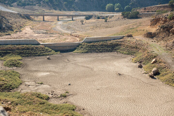 Obraz premium Aerial view of a drought lake and abandoned old dam. Climate change, global warming