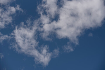 blurred white clouds in blue sky