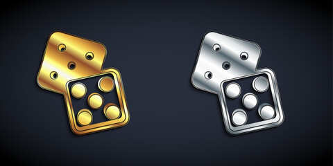 Gold and silver Game dice icon isolated on black background. Casino gambling. Long shadow style. Vector