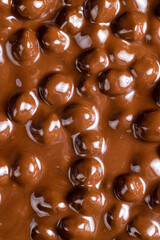 real milk chocolate while cooking with hazelnuts
