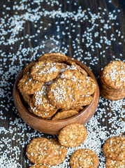 oatmeal thin round cookies with lots of sesame seeds