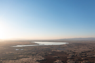 Aerial view of sunset over drought lake. Concept for climate change