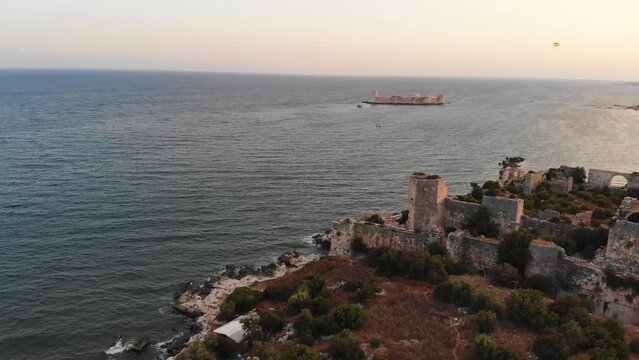 Mersin coastline panorama in Kizkalesi with historical (Kiz kalesi) castle on island background . Travel landmark and destination