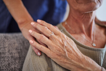 Senior, hands and care for love, support in mature health and generations indoors at home. Hand of...
