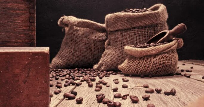 Roasted coffee beans in bag and grinder with ground coffee