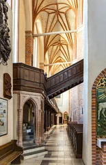 Poster Aisle of historic Holy Mary gothic Kosciol Mariacki church in old town quarter of Trzebiatow in Poland © Art Media Factory