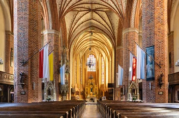 Poster Main nave with altar and presbytery of historic Holy Mary gothic Kosciol Mariacki church in old town quarter of Trzebiatow in Poland © Art Media Factory