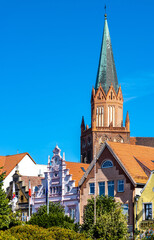 Panorama of Rynek main market square with Holy Mary gothic church in old town quarter of Trzebiatow in Poland © Art Media Factory