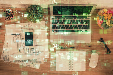 Double exposure of data theme drawing hologram over topview work table background with computer. Concept of technology.