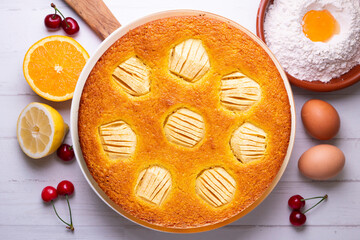 Sponge cake with apple pieces. Traditional French recipe.