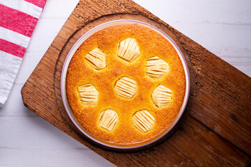 Sponge cake with apple pieces. Traditional French recipe.
