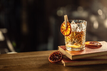 Glass cup with Old Fashioned cocktail in retro style