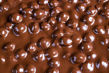 real milk chocolate while cooking with hazelnuts