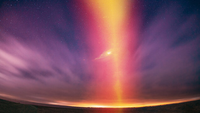 Amazing Beautiful Light Purpurea Illuminated Sky. Pink Light Effect Night Starry Sky Above Rural Countryside. Stars Flare Backlight Natural Background. Soft Colors. Concept Of Dream View. Imagination.