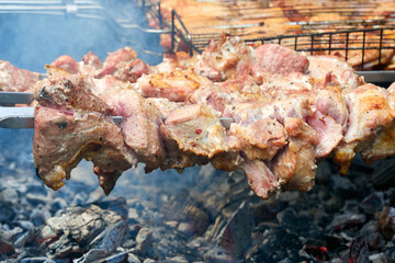 The meat is roasted over an open fire. Barbecue on the coals.  