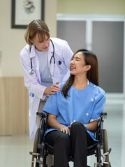 Doctor talk with patient sitting in wheelchair