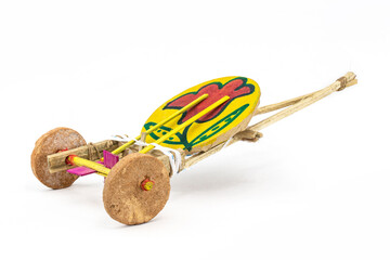 Tomtom gari. traditional handmade new year carnival wagon toy of Boishakhi mela in Bangladesh. made of clay wheel drum and bamboo stick tighten with string. it bits the drum and sounds while dragging.