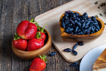 honeysuckle berries in a wooden plate