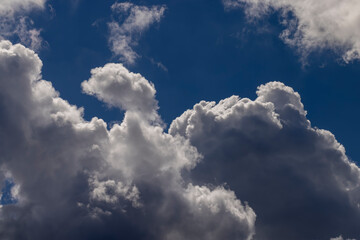 Clouds floating across the sky in the daytime