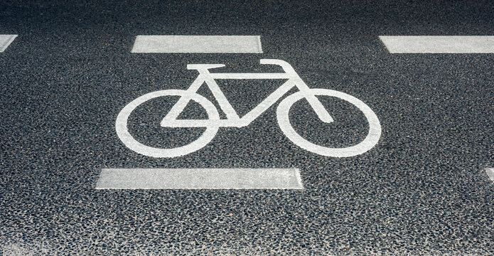 bicycle icon marking a bike lane on a road