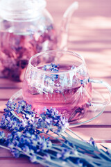Obraz na płótnie Canvas Glass cup of lavender tea.