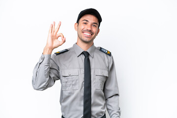 Young safeguard man over isolated white background showing ok sign with fingers