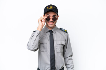 Young safeguard man over isolated white background with glasses and surprised
