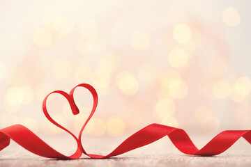 Red heart of ribbon. Valentines day background.