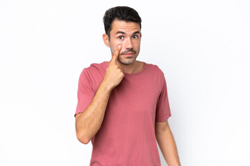 Obraz premium Young handsome man over isolated white background showing something
