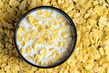 dry breakfast corn flakes of yellow color , close up