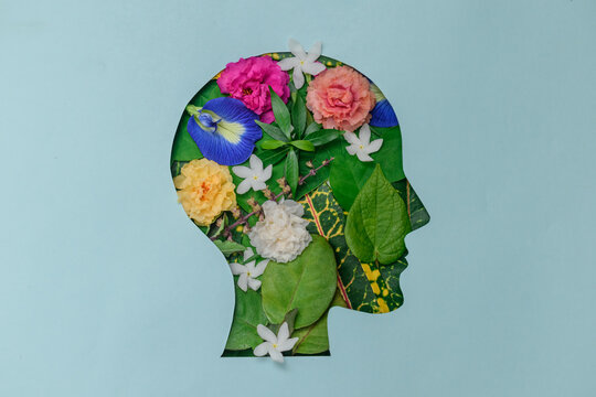 Papercut Head With Green Leaves And Flowers. Mental Health, Wellness, Self Care, Psychology, Green Thinking, Happy Life, Ecology Concept