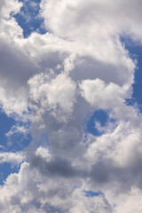 Clouds floating across the sky in the daytime