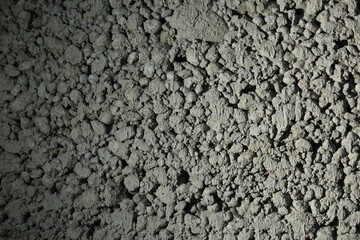 close up of a gray foam concrete building block. grey textured background